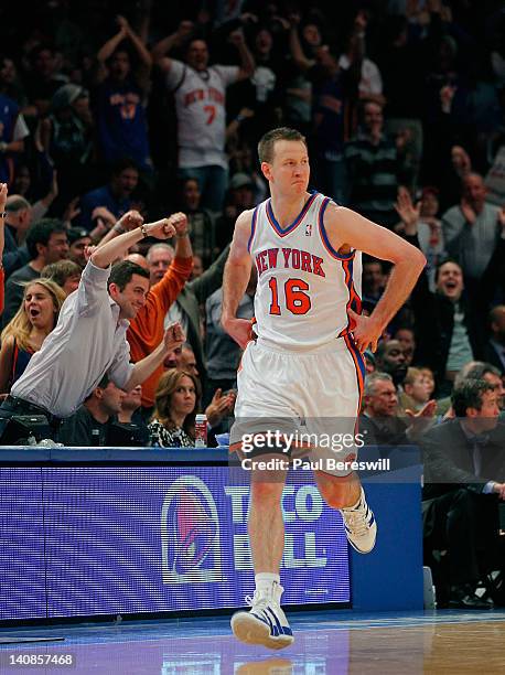 Steve Novak of the New York Knicks runs back upcourt to the cheers of the crowd after scoring on a three polnt shot against the Dallas Mavericks on...