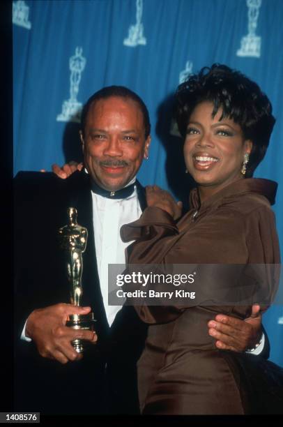 Quincy Jones and Oprah Winfrey attend the 67th Annual Academy Awards ceremony March 27, 1995 in Los Angeles, CA. This year''s ceremony recognizes...