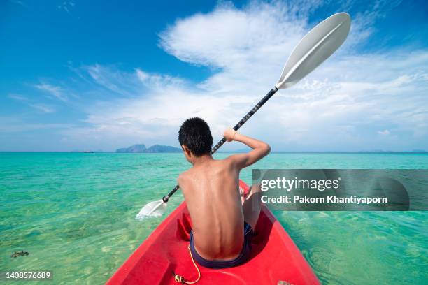 boy is kayaking - maldives boat stock pictures, royalty-free photos & images