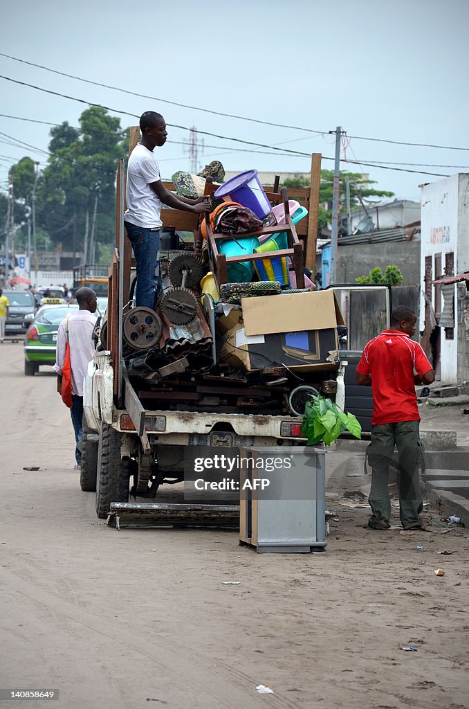 Loading Truck With 4 People People load a truck on March 7, 2012 in Mpila, east of Brazzaville ...