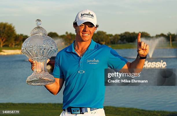 Rory McIlroy of Northern Ireland poses with the trophy after winning the Honda Classic at PGA National on March 4, 2012 in Palm Beach Gardens,...