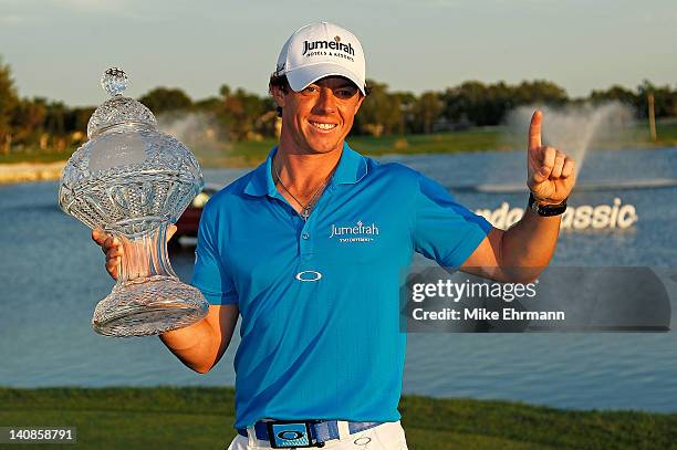 Rory McIlroy of Northern Ireland poses with the trophy after winning the Honda Classic at PGA National on March 4, 2012 in Palm Beach Gardens,...