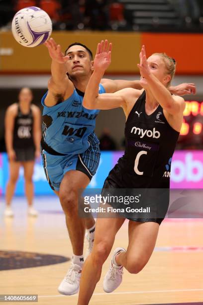 Shannon Saunders of the Silver Ferns and Junior Tana of NZ Men compete during the Cadbury Netball Series match between New Zealand Silver Ferns and...