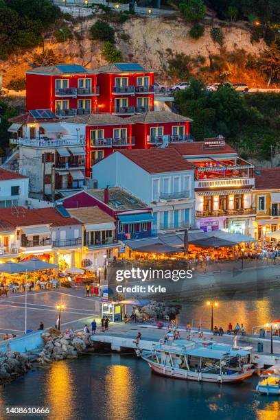 panoramic night view of parga city in greece - epirus greece stock pictures, royalty-free photos & images