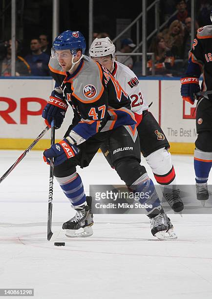 Andrew MacDonald of the New York Islanders skates against the Ottawa Senators at Nassau Veterans Memorial Coliseum on February 20, 2012 in Uniondale,...