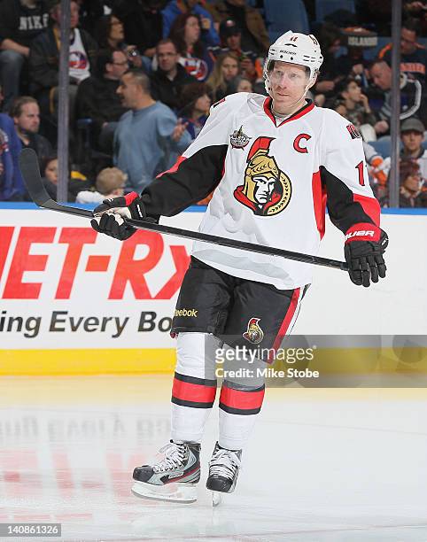 Daniel Alfredsson of the Ottawa Senators skates against the New York Islanders at Nassau Veterans Memorial Coliseum on February 20, 2012 in...