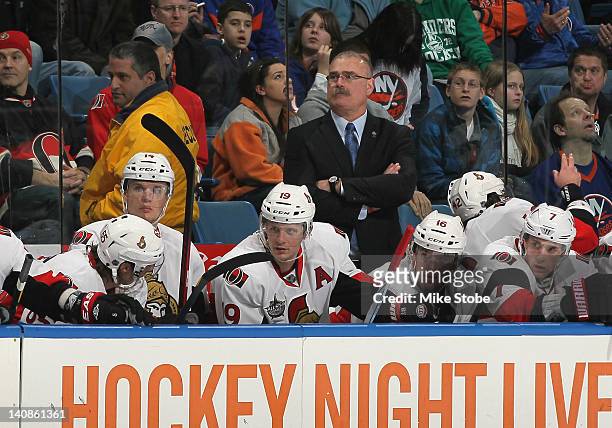 Paul MacLean of the Ottawa Senators looks on from the bench against the New York Islanders at Nassau Veterans Memorial Coliseum on February 20, 2012...
