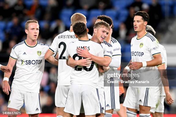 Joe Gelhardt of Leeds United celebrates with team mates after scoring a goal during the 2022 Queensland Champions Cup match between Brisbane Roar and...