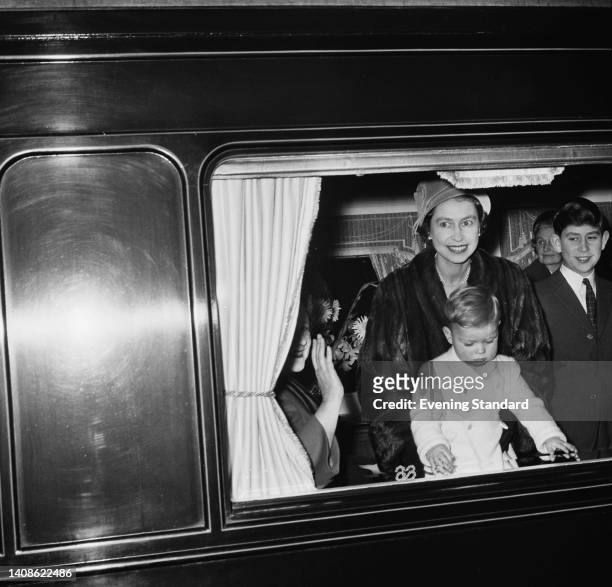 British Royals Queen Elizabeth The Queen Mother , her daughter Queen Elizabeth II with her sons, Prince Andrew and Prince Charles, on the train to...