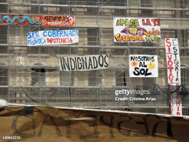 Banners placed by indignant at the facade of a building under restauration on in the Puerta del Sol, camp of the indignants on Puerta del Sol, on...