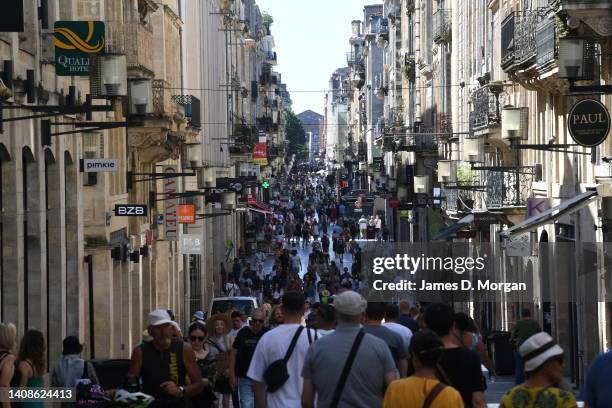 Crowds of locals and tourists walk down the main shopping street on July 14, 2022 in Bordeaux, France. The French population today celebrate Bastille...