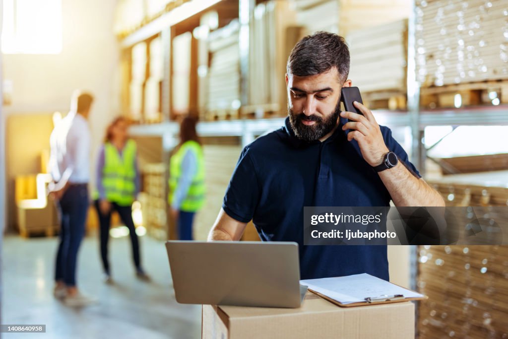 Startup small business owner checking or accepting orders on his laptop