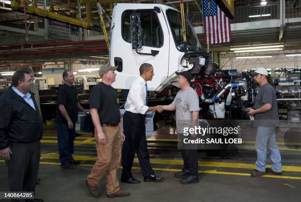 President Barack Obama tours the Daimler Trucks North America Manufacturing plant prior to speaking on the economy and fuel consumption in Mount...