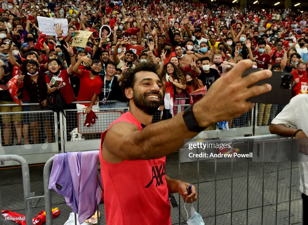 Mohamed Salah of Liverpool taking a selfie with fans at the end of a ...