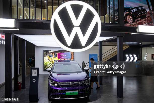 Attendees look around the at Volkswagen of ID.6X during 2022 Central China International Auto Show on July 14, 2022 in Wuhan, Hubei province, China....