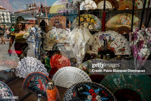 Fans are on display at a shopwindo at Puerta Del Sol Square as temperatures continue to soar on July 14, 2022 in Madrid, Spain. Europe is currently...