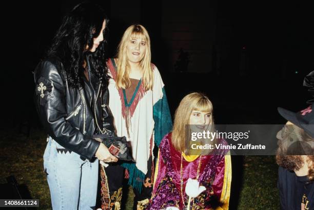 Cher , daughter Chastity Bono and Chance a.k.a Heidi Shink talk with an unidentified man at Richie Sambora's "Stranger in This Town" Album Release...