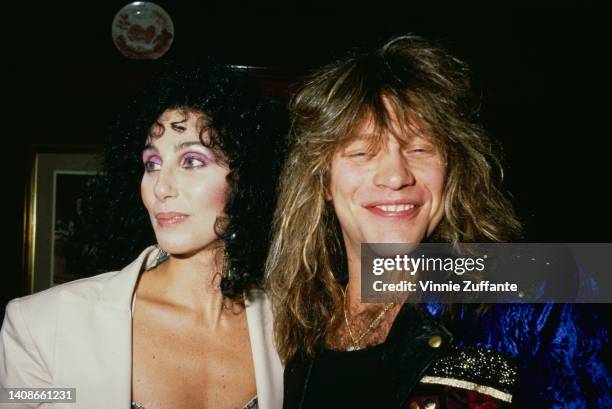 Cher and Jon Bon Jovi attend the 15th Annual American Music Awards, held at the Shrine Auditorium in Los Angeles, California, 25th January 1988.