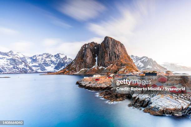 traditional rorbu cabins on cliffs, hamnoy, lofoten - nordland county stock pictures, royalty-free photos & images