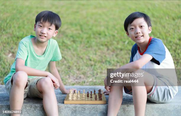 children started the classic a chess match - kids playing chess stock pictures, royalty-free photos & images