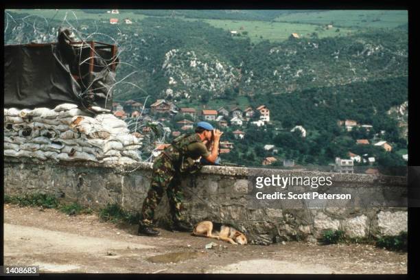 British UN soldier looks at a Serbian held area September 12, 1995 in Sarajevo, Bosnia and Herzegovina. When Bosnia declared its independence in...