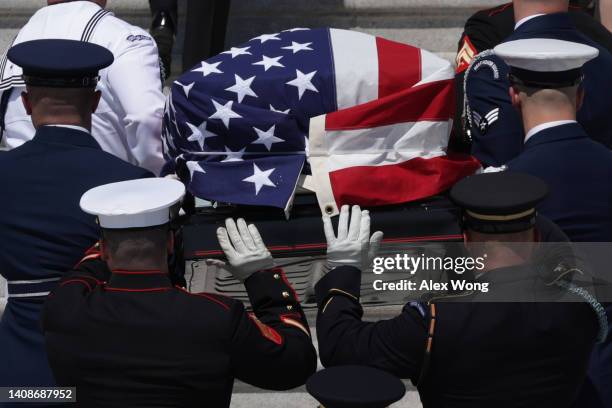 Military honor guard carries the flag-draped casket of Hershel W. "Woody" Williams, the last remaining Medal of Honor recipient from World War II, up...