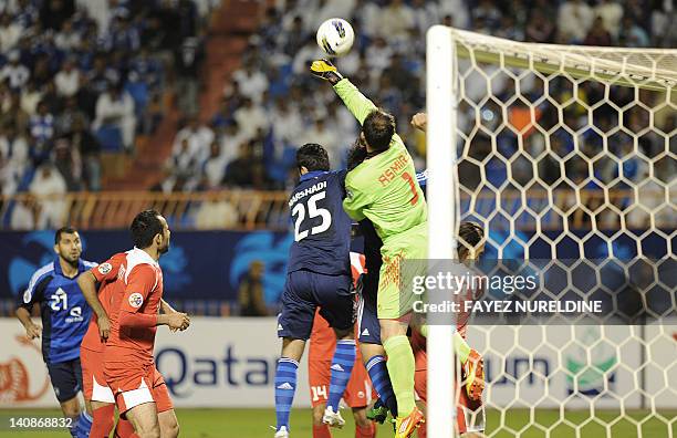 Iran's Piroozi Athletic goalkeeper Asmir Avdukic sends the ball before Saudi Al-Hilal's Majed Marshadi during their Group D, AFC Champions League...