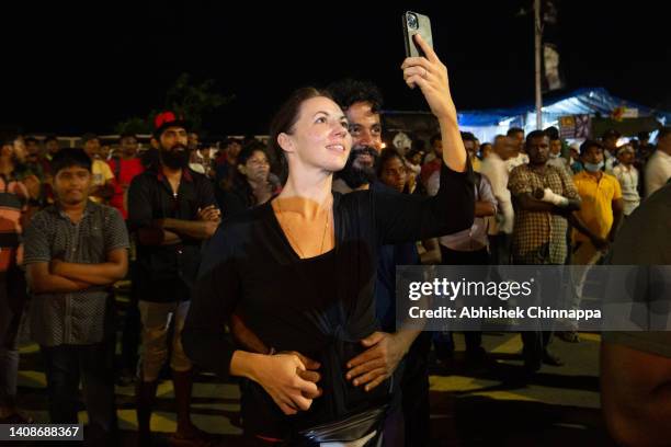 People react upon learning about the resignation of President Gotabaya Rajapaksa on July 14, 2022 in Colombo, Sri Lanka. The office of Mahinda Yapa...