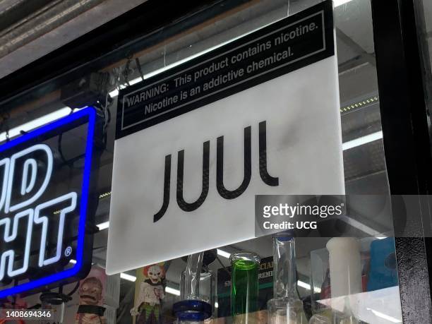 Juul Vape sign in convenience store window, Queens, New York.