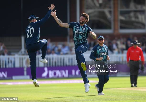 Reece Topley of England celebrates with Jason Roy after dismissing Shikhar Dhawan of India during the 2nd Royal London Series One Day International...