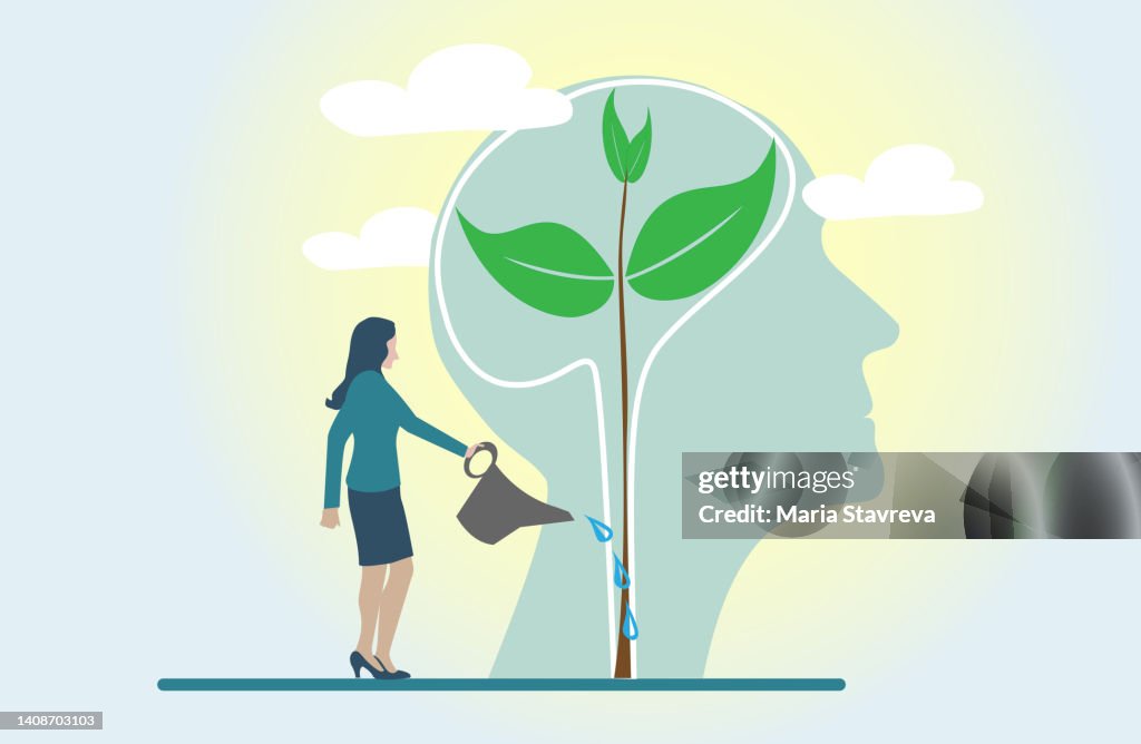 Mindset Concept.Watering plants with big brain growth mindset concept.