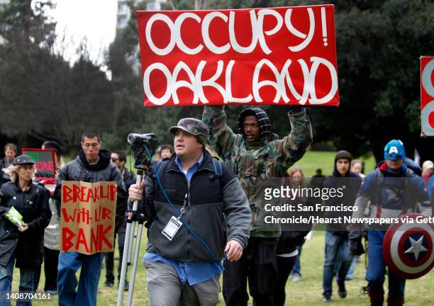 Video blogger Spencer Mills covers an Occupy Oakland action against banks with streaming video in Oakland, Calif. On Wednesday, Feb. 29, 2012. Mills...