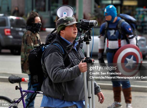 Video blogger Spencer Mills streams live an Occupy Oakland action against banks in Oakland, Calif. On Wednesday, Feb. 29, 2012. Mills uses a...