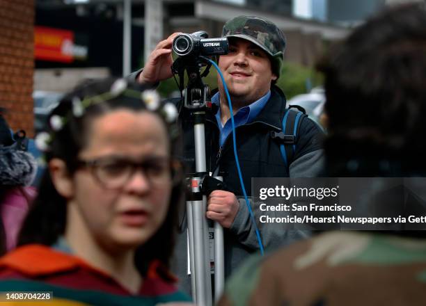 Video blogger Spencer Mills streams live an Occupy Oakland action against banks in Oakland, Calif. On Wednesday, Feb. 29, 2012. Mills uses a...