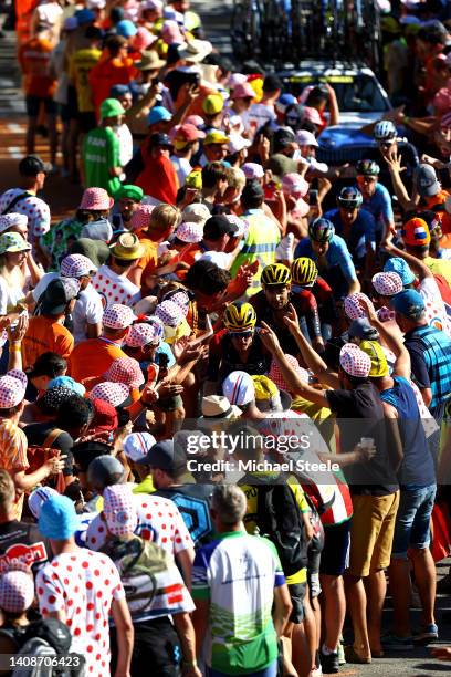 Dylan Van Baarle of Netherlands and Filippo Ganna of Italy and Team INEOS Grenadiers compete passing through The Dutch corner climbing to the L'Alpe...