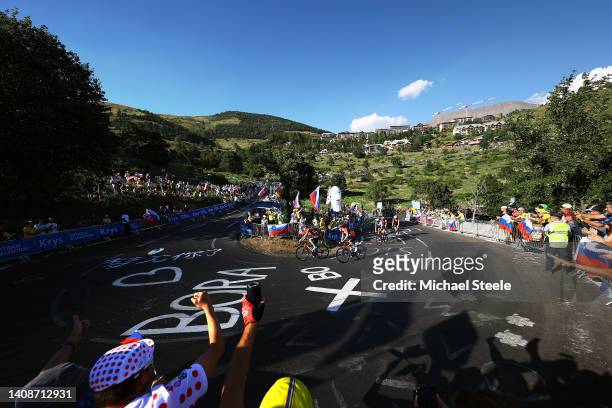 Matej Mohoric of Slovenia and Team Bahrain Victorious competes climbing to the L'Alpe d'Huez while fans cheer during the 109th Tour de France 2022,...