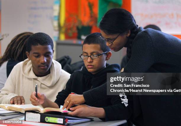 Humanities teacher Terri Wiley helps students Dexter Cato and Alejandro Portillo at Gateway High School in San Francisco, Calif. On Wednesday, Oct....