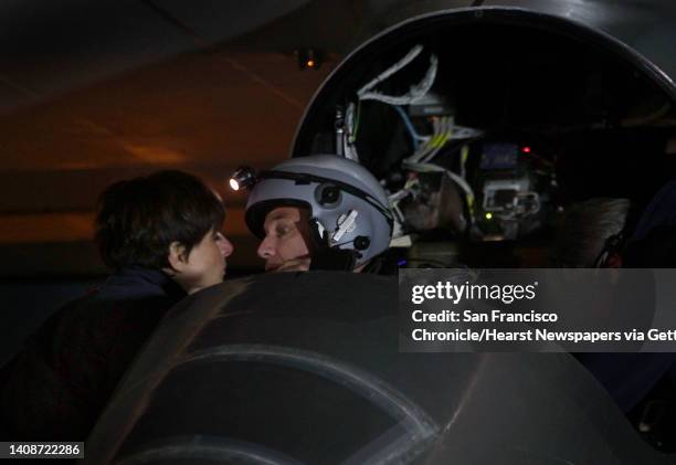 Pilot Bertrand Piccard kisses his wife Michele shortly before he takes off aboard the Solar Impulse from Moffett Field in Mountain View, Calif. On...