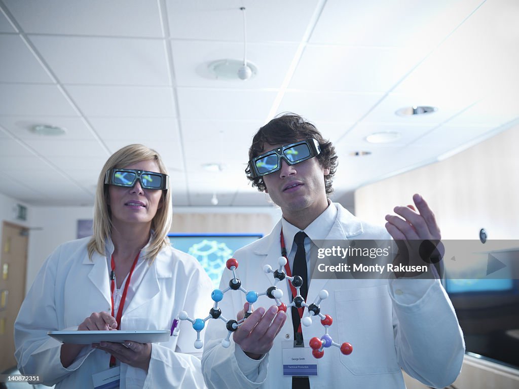 Scientists wearing 3D glasses in lab