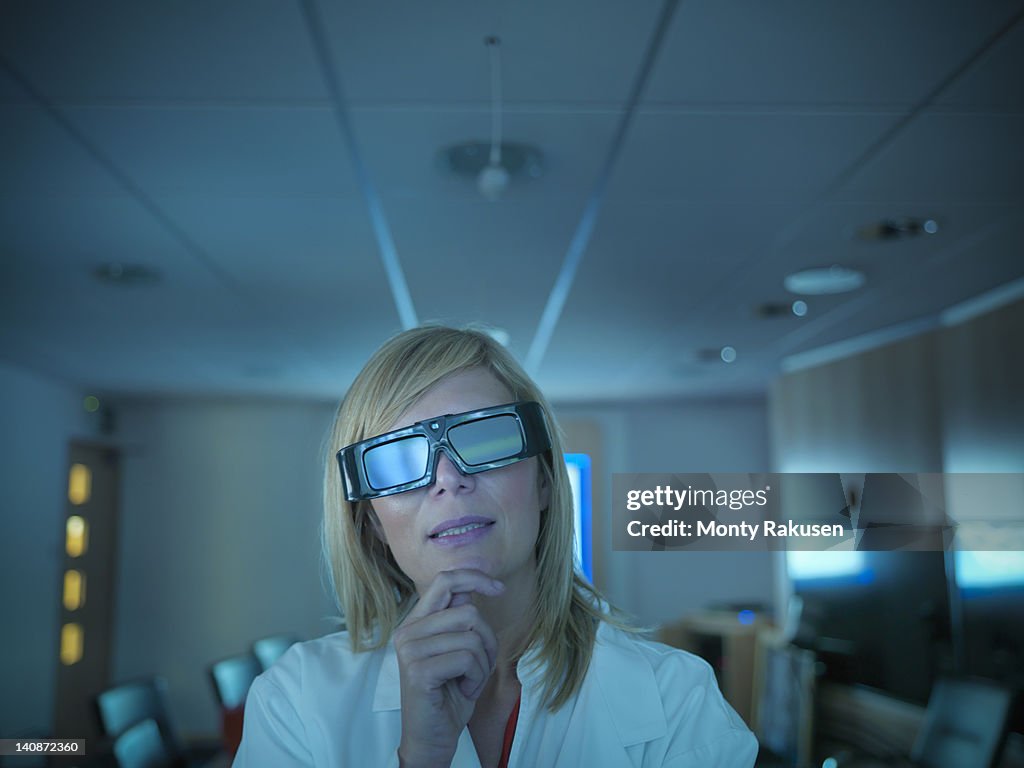 Scientist wearing 3D glasses in lab