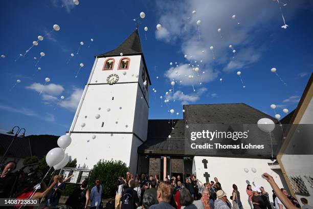 Residents remember the victims of the devastating floods with a church service, balloons and candles on the one year anniversary, on July 14, 2022 in...