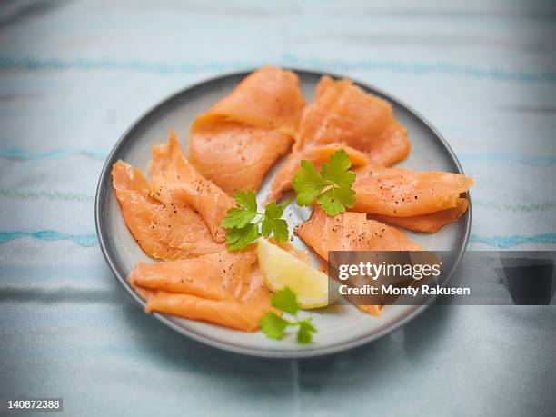 plate of hand reared scottish smoked salmon - smoked salmon stock pictures, royalty-free photos & images