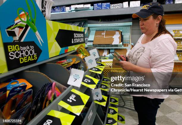 High school teacher Rachel Tevlin shops for school supplies for her students at an office supply store in Mountain View, Calif. On Saturday, Aug. 3,...