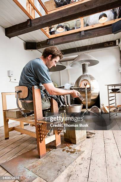 glassblower shaping hot glass - glass blowing stock pictures, royalty-free photos & images