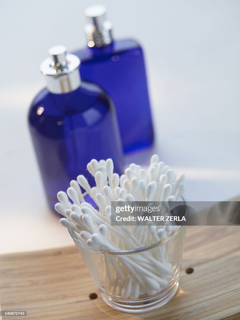 Close up of cotton buds and perfume
