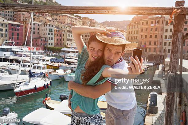 couple taking picture of themselves - camogli bildbanksfoton och bilder