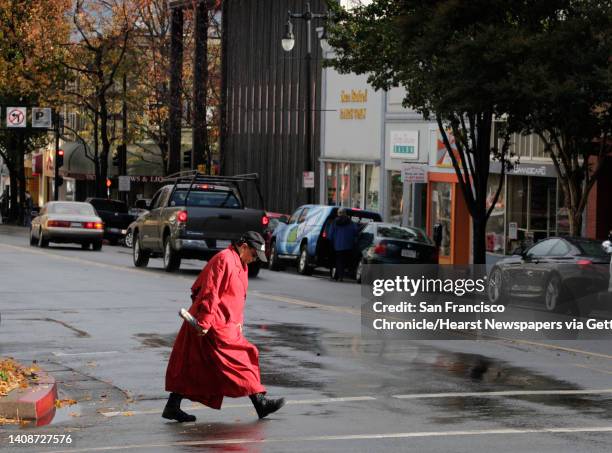 Woman crosses 4th Street in downtown San Rafael, Calif. On Wednesday, Nov. 20, 2013. A recent uptick in the transient homeless population has...