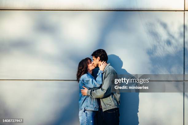 Kissing 1,076 Couple Kissing Wall Stock Photos, High-Res Pictures, and Images ...
