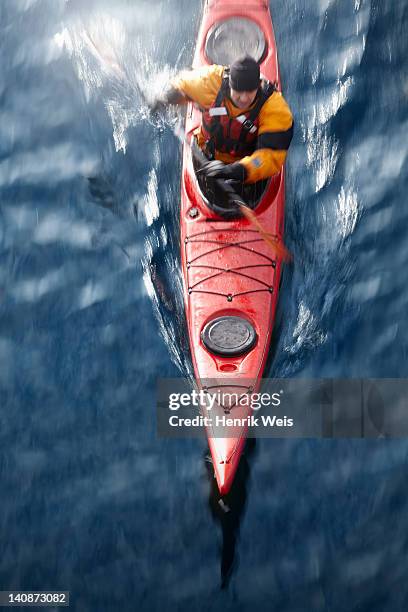 luftbild von kajakfahrer in wasser - kayak stock-fotos und bilder
