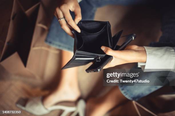 woman with empty wallet spent all money for shopping - wallet stock pictures, royalty-free photos & images
